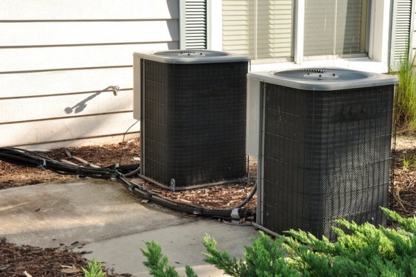 Two outdoor central air conditioner units