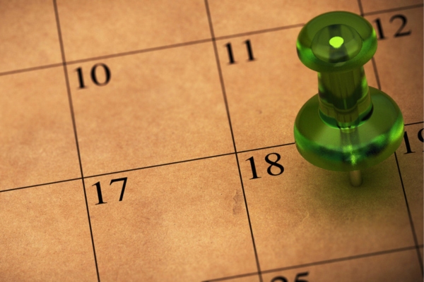 push pin on a paper calendar depicting Skipping Routine Air Conditioner Maintenance