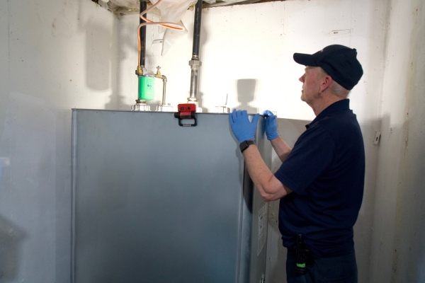 Fawcett Energy expert inspecting oil tank