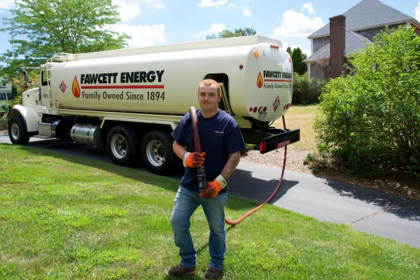 Fawcett Energy heating oil truck and driver holding hose