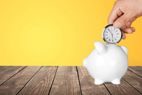 inserting pocket watch in a piggy bank depicting Save Time and Control Heating Costs